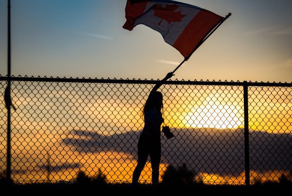 woman waving a flag at americas festival